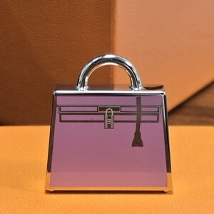 HERMES Curiosite Curiosity Kelly bag pendant charm metal Pink Permabrass